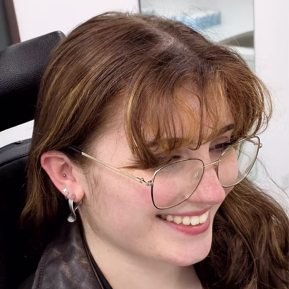 Smiling client with a flat piercing