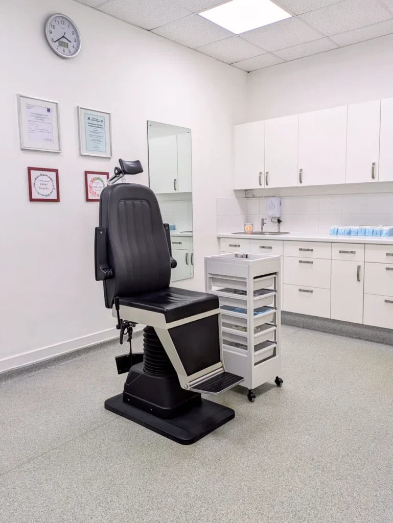 Interior shot of the piercing room at Metal Fatigue Piercing Bournemouth showing the piercing chair